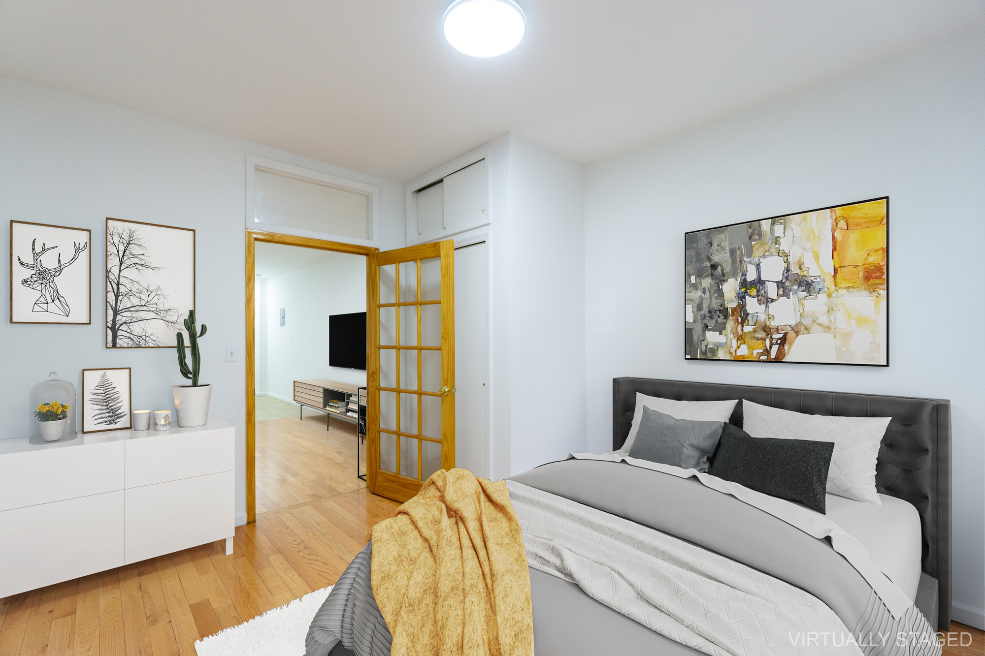 315 East 5th Street, Unit 1C Manhattan, NY 10003 - Photo 7 of 15 a bed room with a bed and a painting on the wall