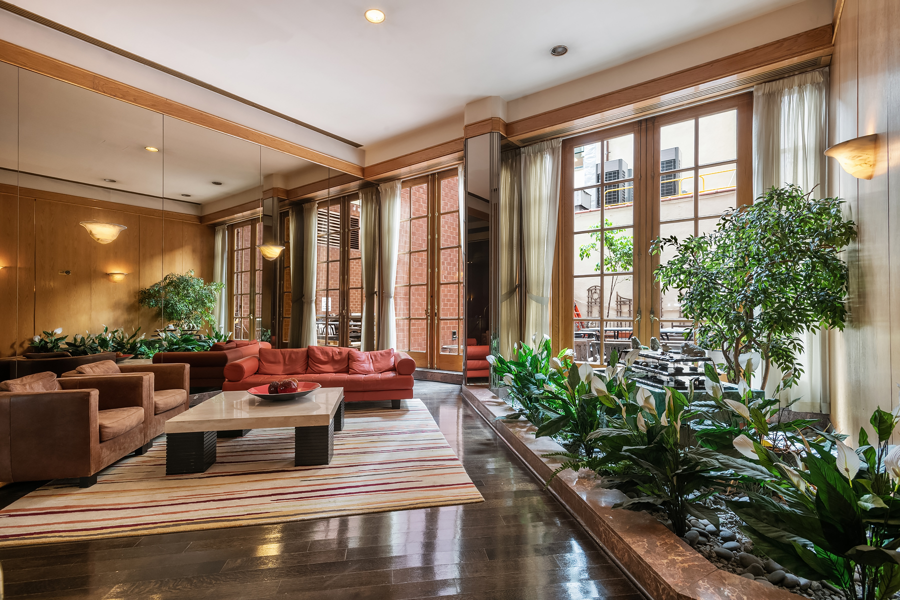 330 East 75th Street, Unit 3L Manhattan, NY 10021 - Photo 13 of 14 a living room with furniture and a potted plant