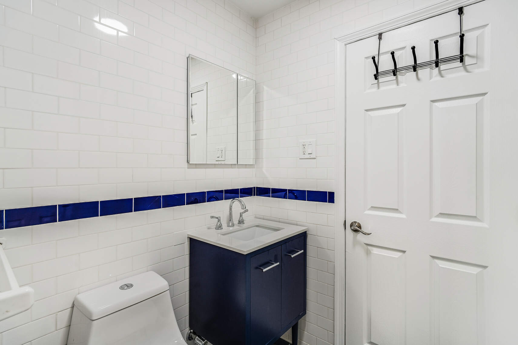 220 West 111th Street, Unit 1A Manhattan, NY 10026 - Photo 5 of 10 a bathroom with a sink and a mirror