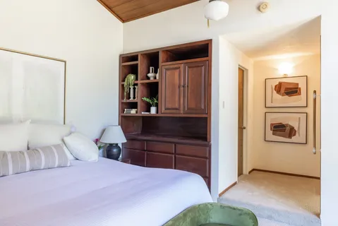 a bedroom with a bed and a cabinets