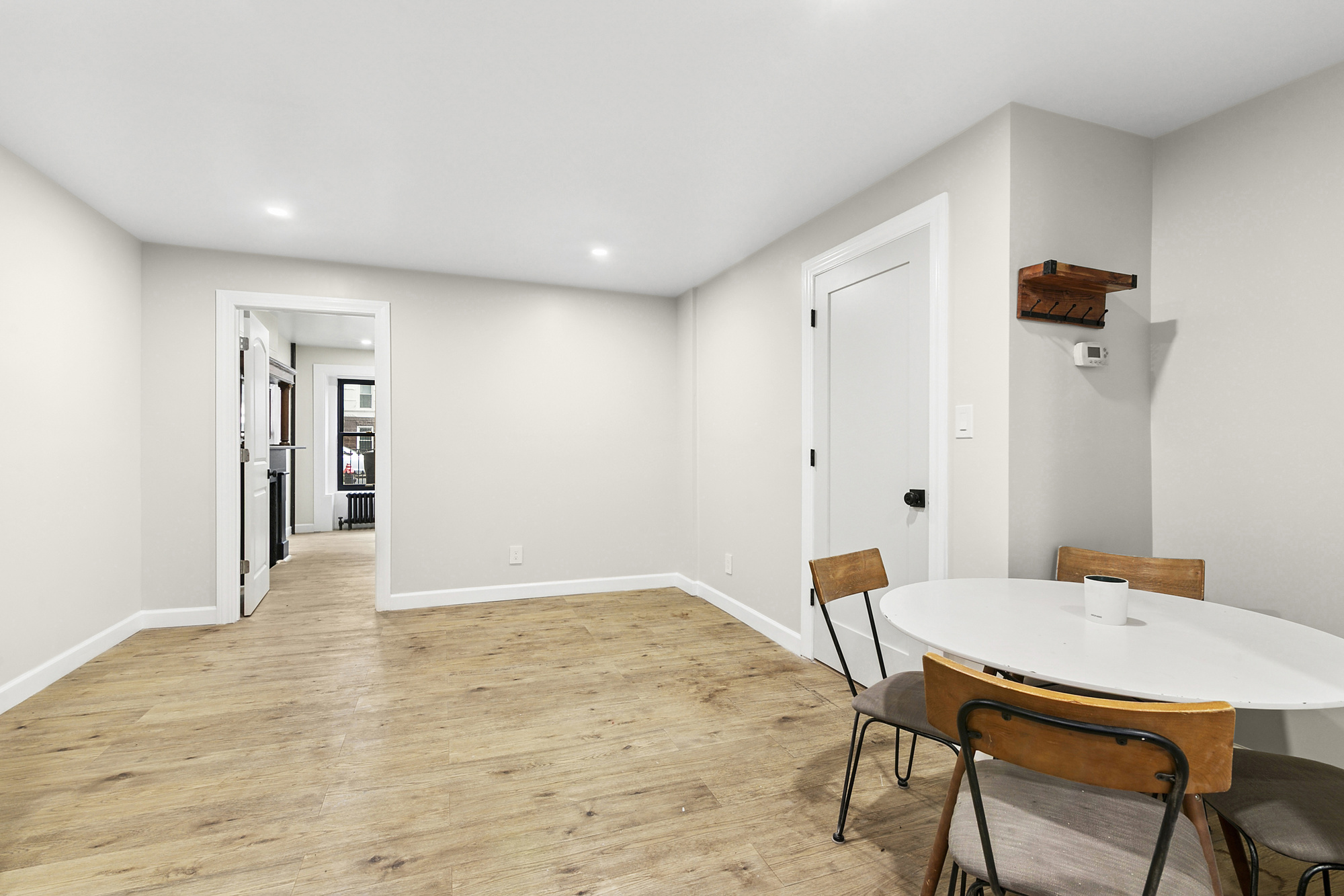 555 MacDonough Street, Unit 1 Brooklyn, NY 11233 - Photo 2 of 7 a view of a room with furniture and wooden floor