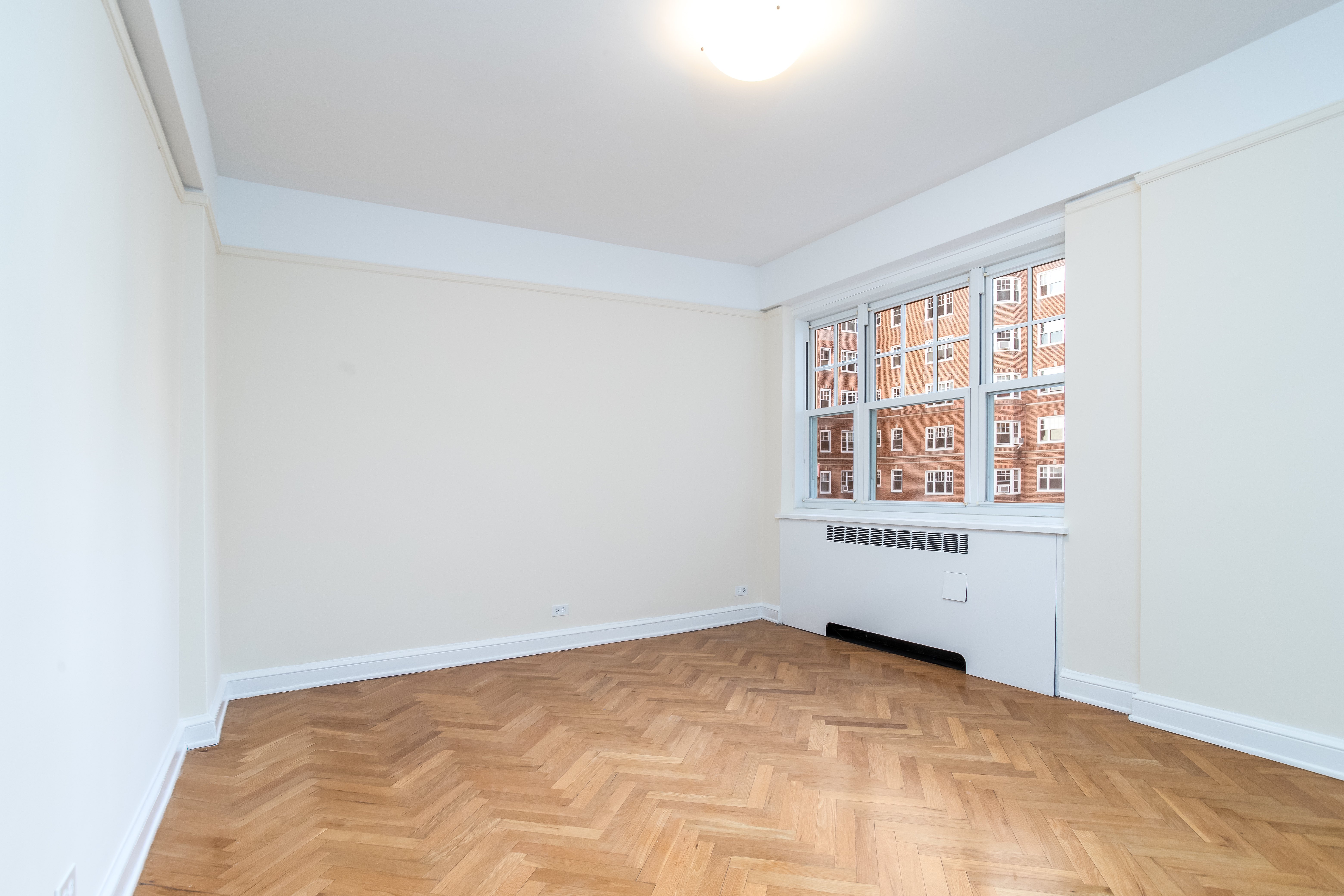 180 Cabrini Boulevard, Unit 37 Manhattan, NY 10033 - Photo 13 of 35 an empty room with windows