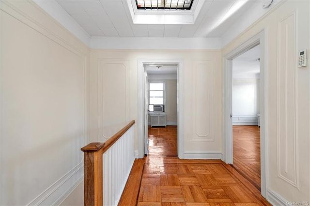 1186 Brooklyn Avenue, Unit N A Brooklyn, NY 11203 - Photo 13 of 17 a view of a hallway with wooden floor and staircase