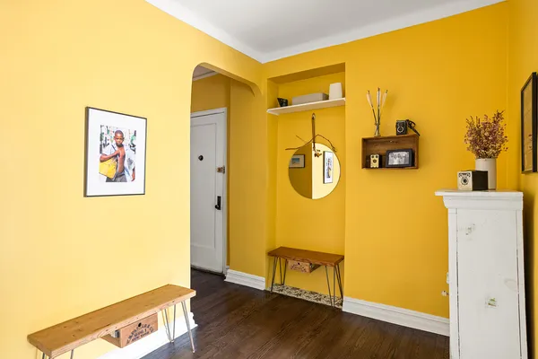 a view of a room with wooden floor