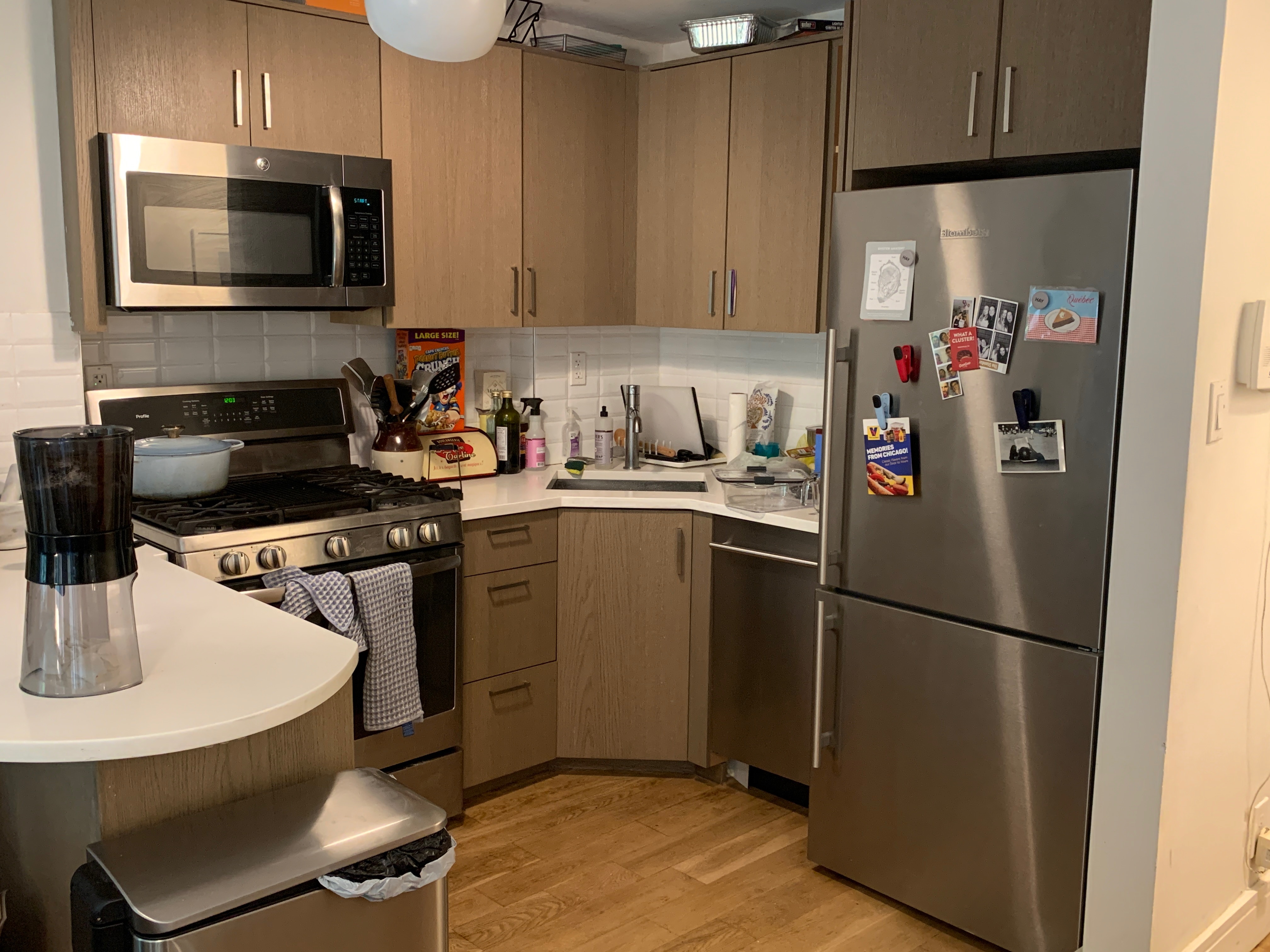 a kitchen with a sink appliances and cabinets
