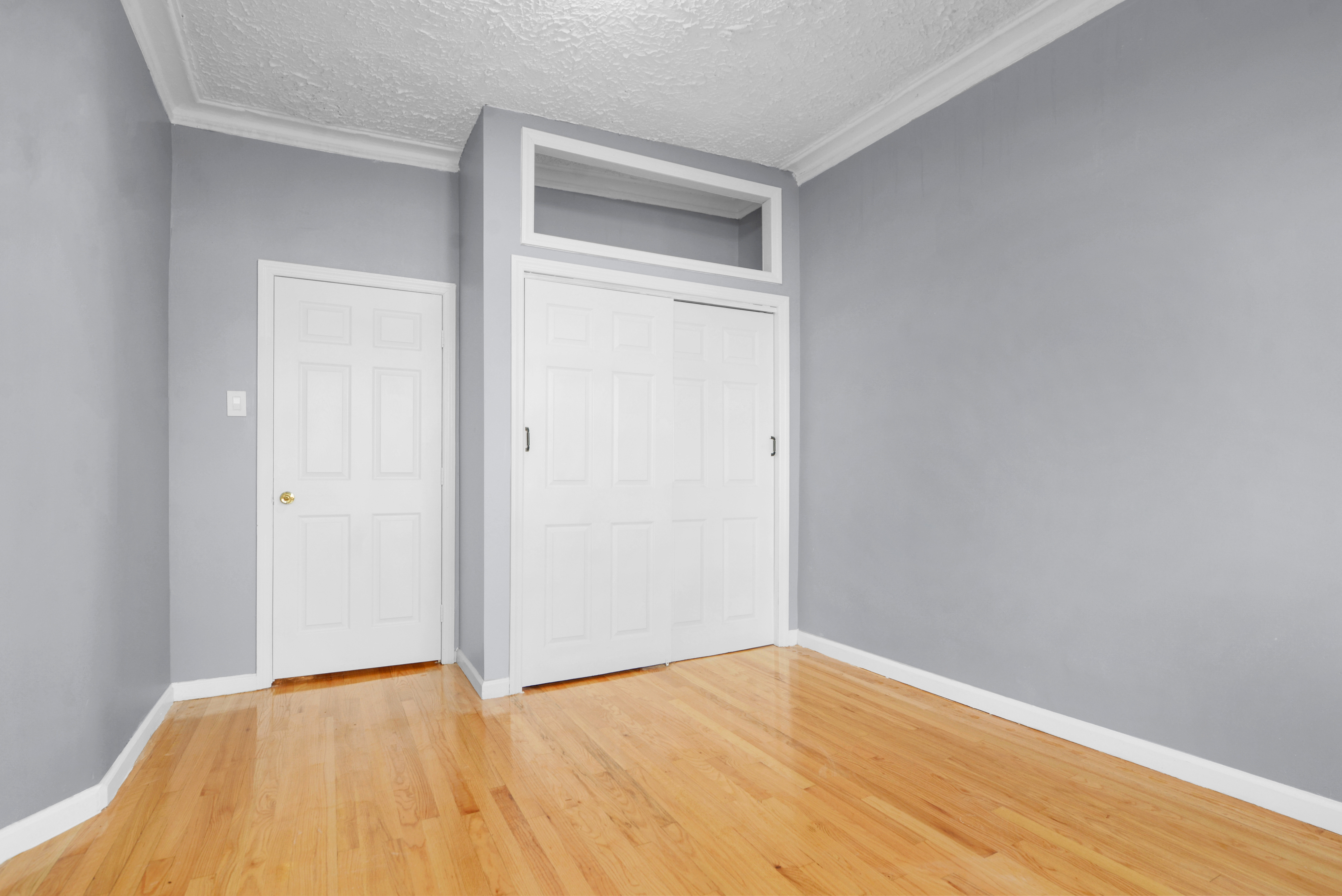 2302 Bedford Avenue, Unit 3 Brooklyn, NY 11226 - Photo 5 of 25 a view of an empty room with wooden floor