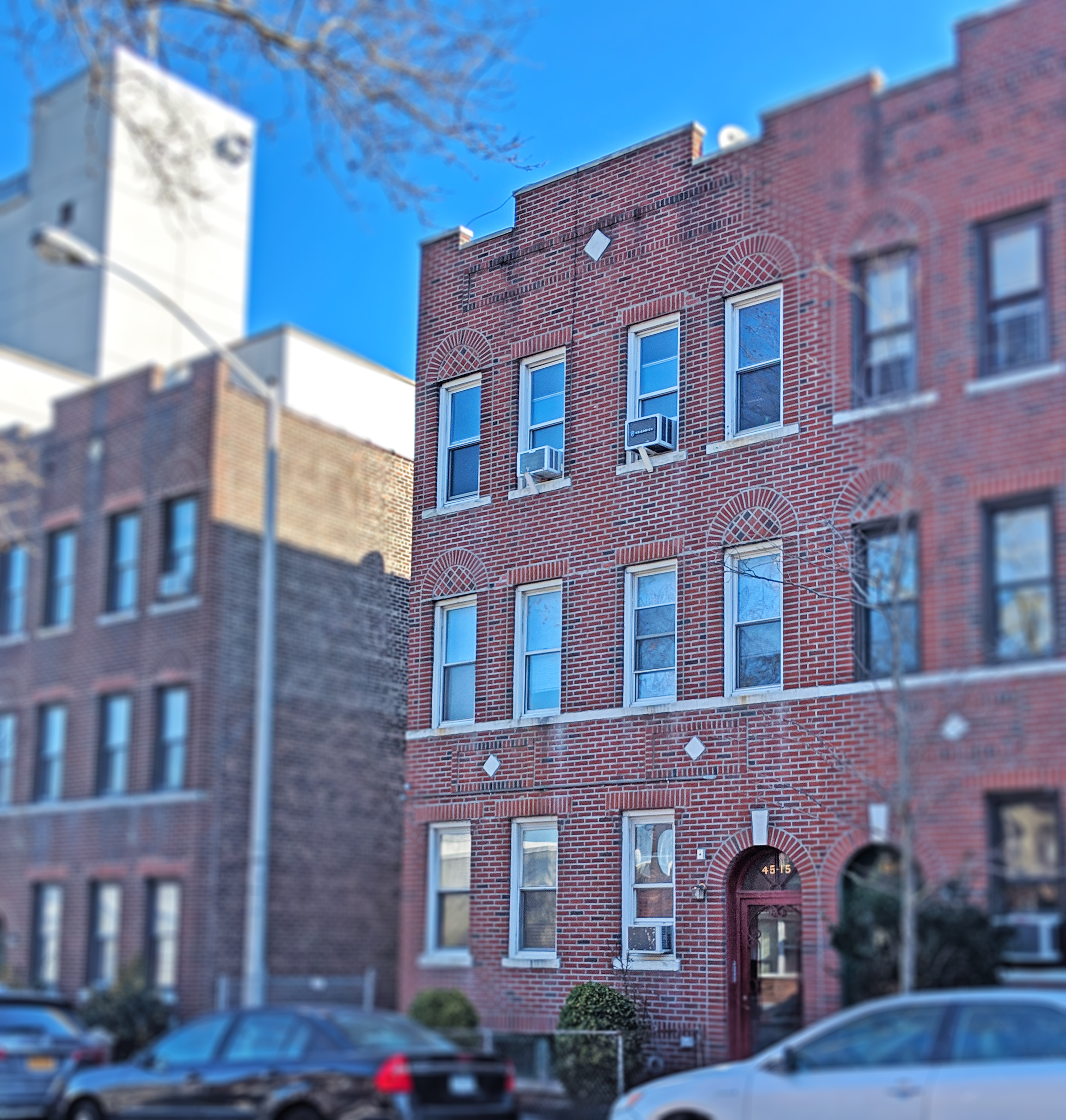 45-15 41st Street, Unit 3R Queens, NY 11104 - Photo 6 of 7 a large building with a lot of windows