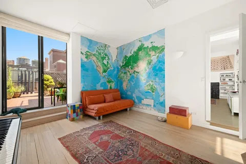 a living room with furniture and a rug