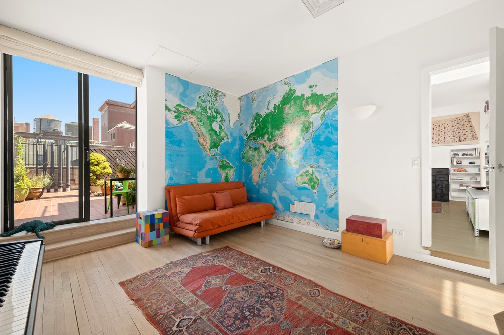 205 West 89th Street, Unit PH6/7 Manhattan, NY 10024 - Photo 10 of 20 a living room with furniture and a rug