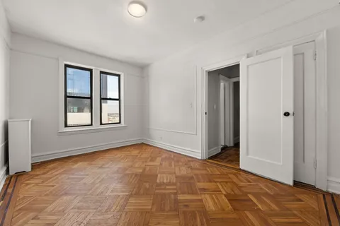 a view of an empty room and window