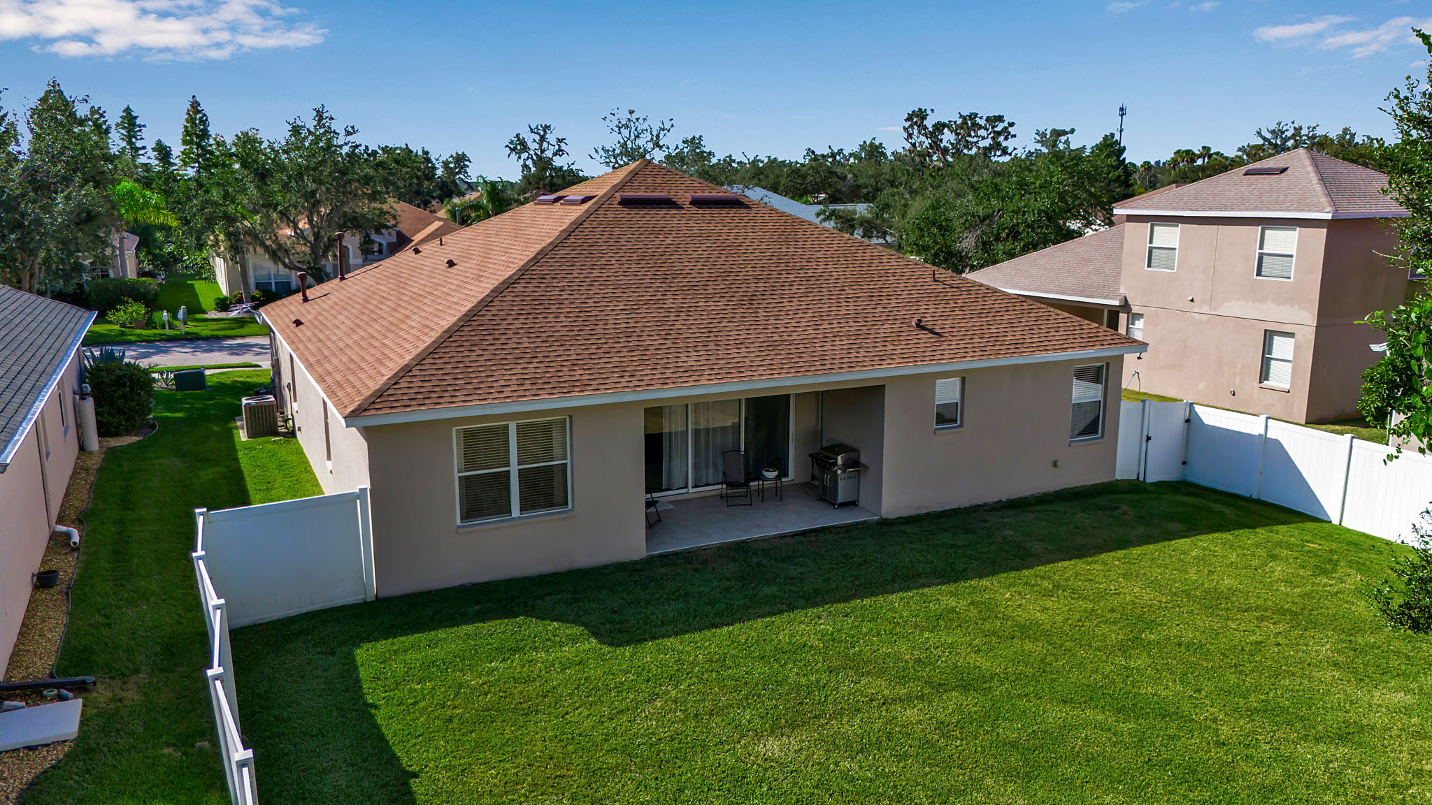 6106 34th Court East Bradenton, FL 34203 - Photo 57 of 69 a aerial view of a house with a yard deck and a garden