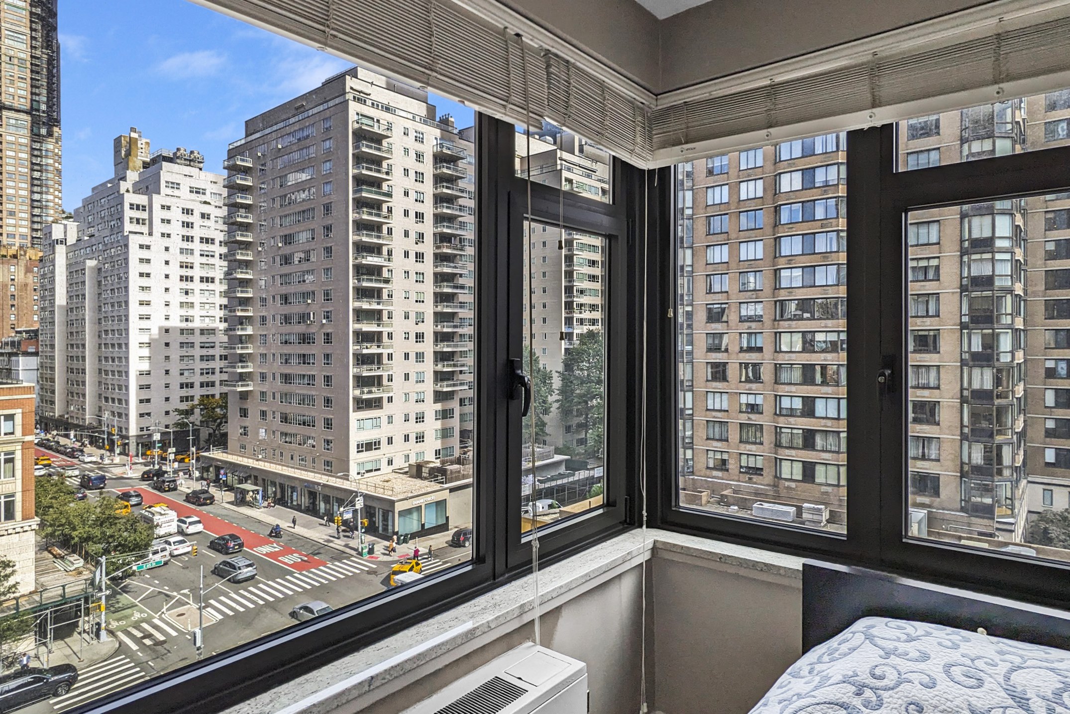 160 East 65th Street, Unit 8A Manhattan, NY 10065 - Photo 11 of 13 a view of a window and bench in front of a building