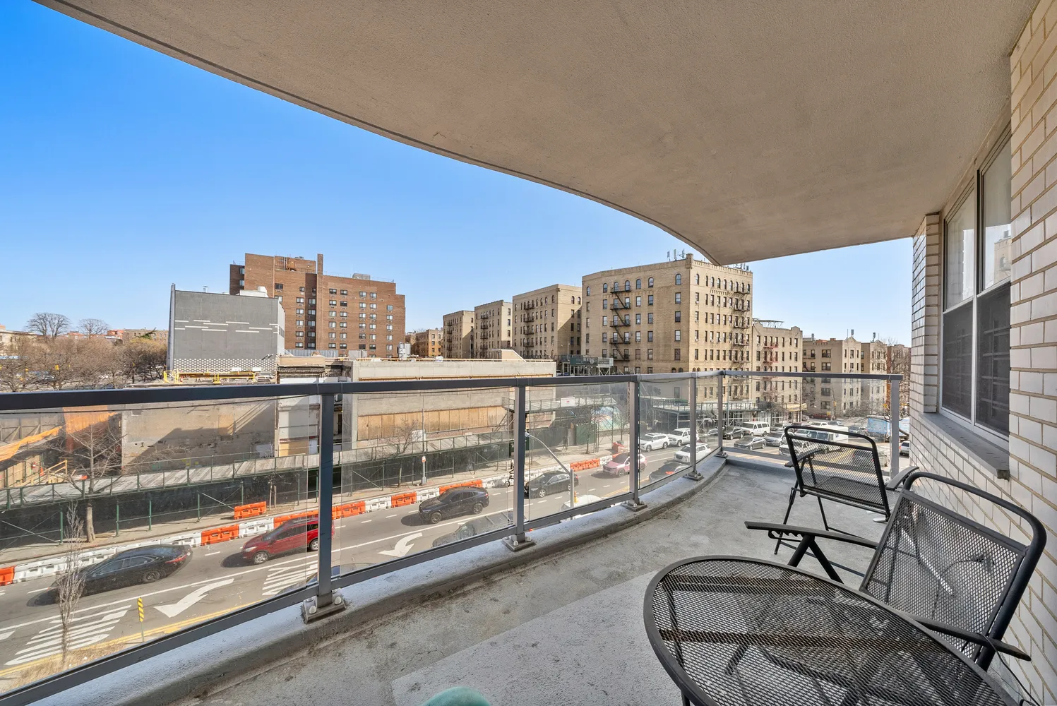 a view of a hallway with a chandelier and living room