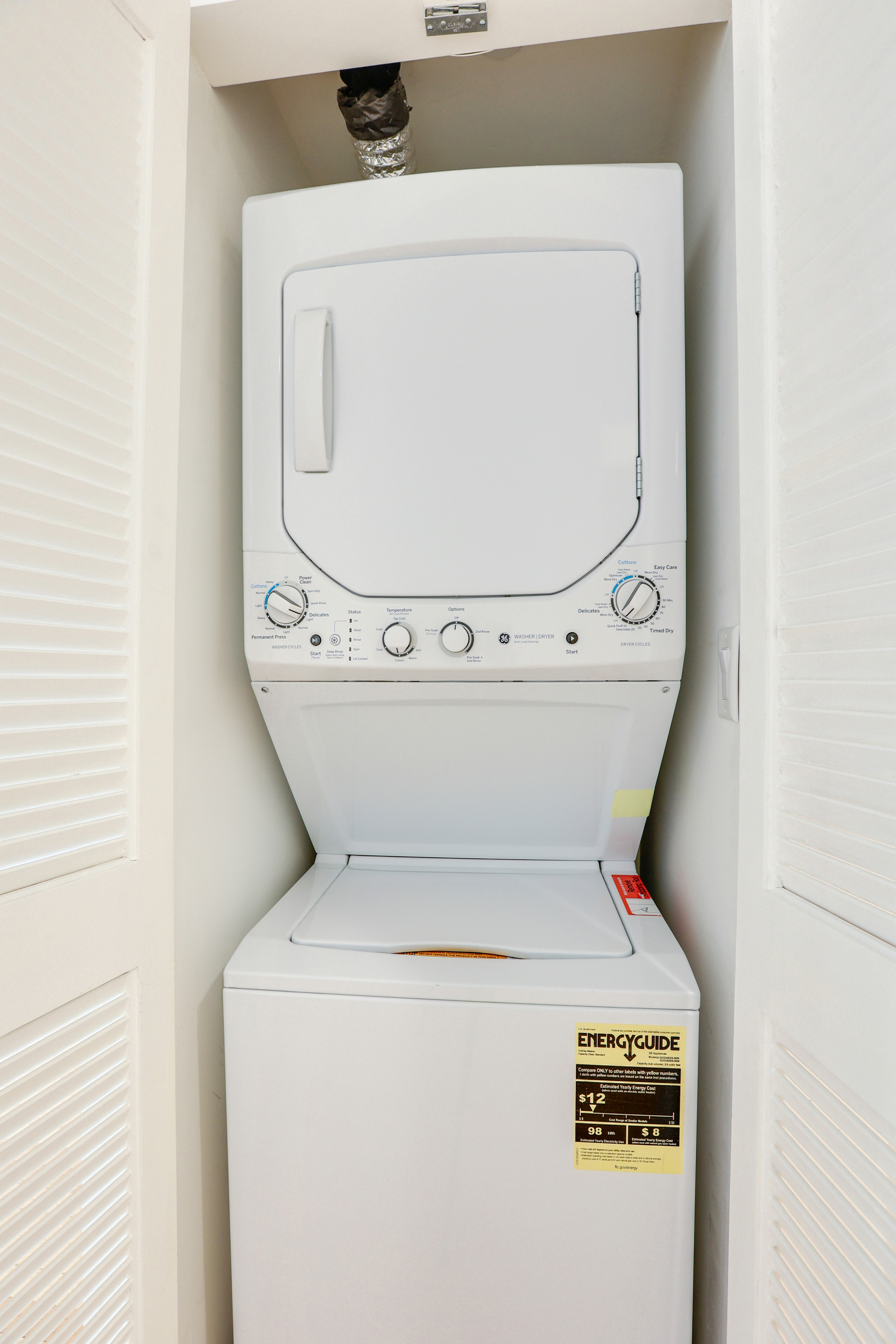 230 West 75th Street, Unit 4 Manhattan, NY 10023 - Photo 15 of 16 a utility room with dryer and washer