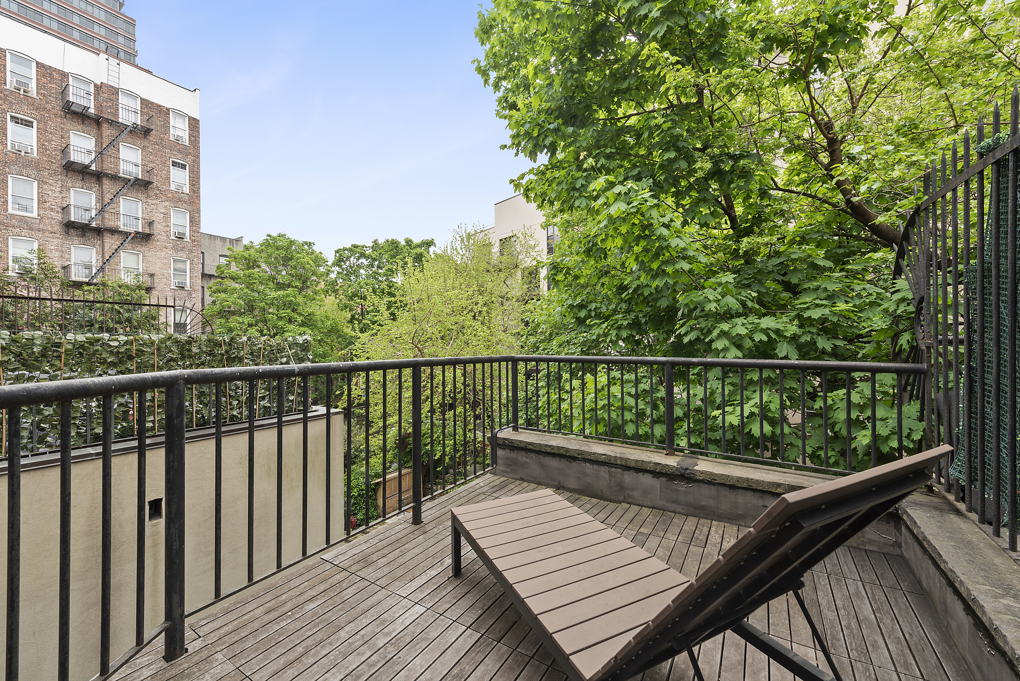 22 West 120th Street Manhattan, NY 10027 - Photo 13 of 21 a view of balcony with wooden floor and fence