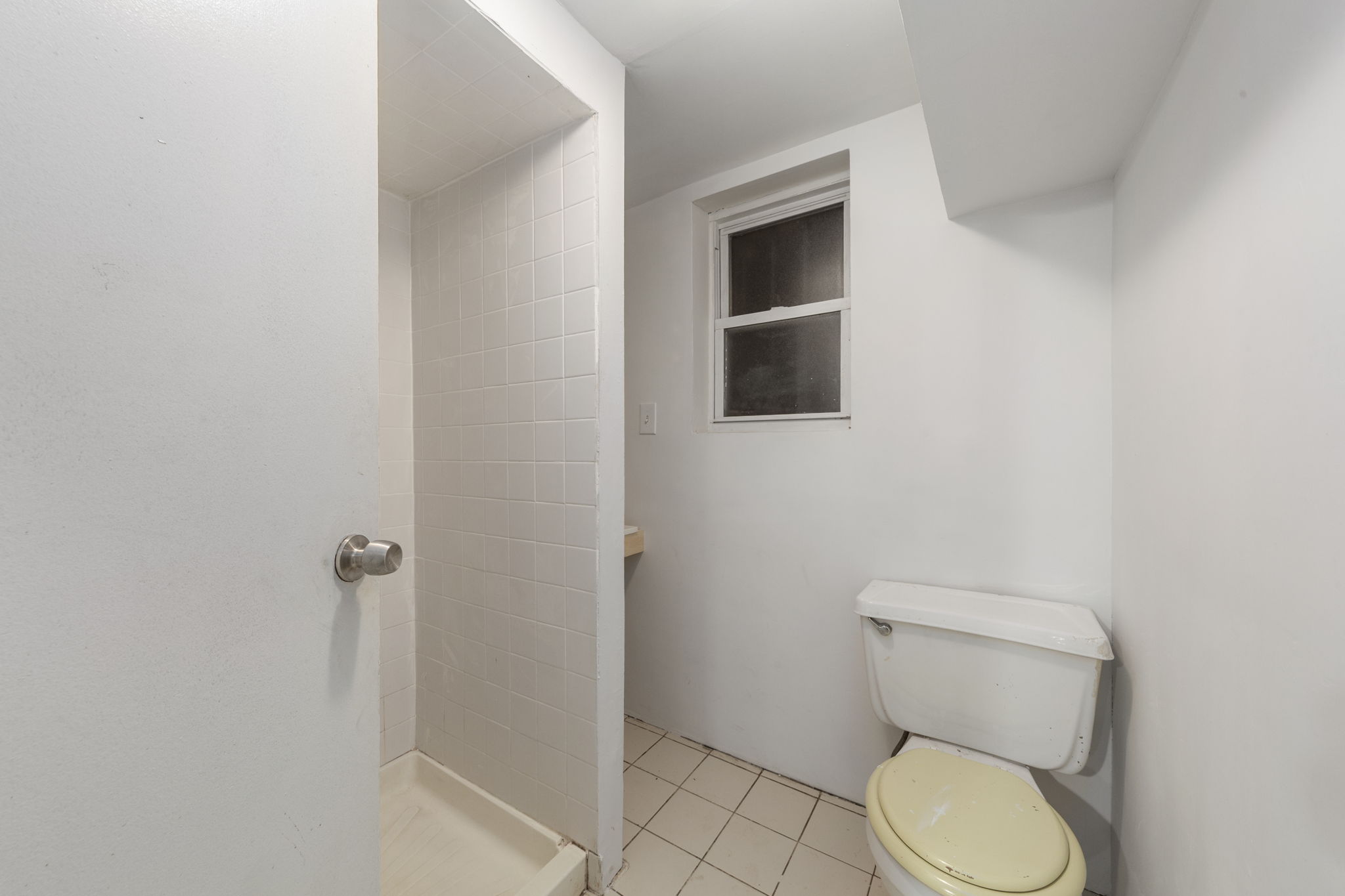 1218 Saint Marks Avenue Brooklyn, NY 11213 - Photo 30 of 42 a white toilet sitting next to a shower