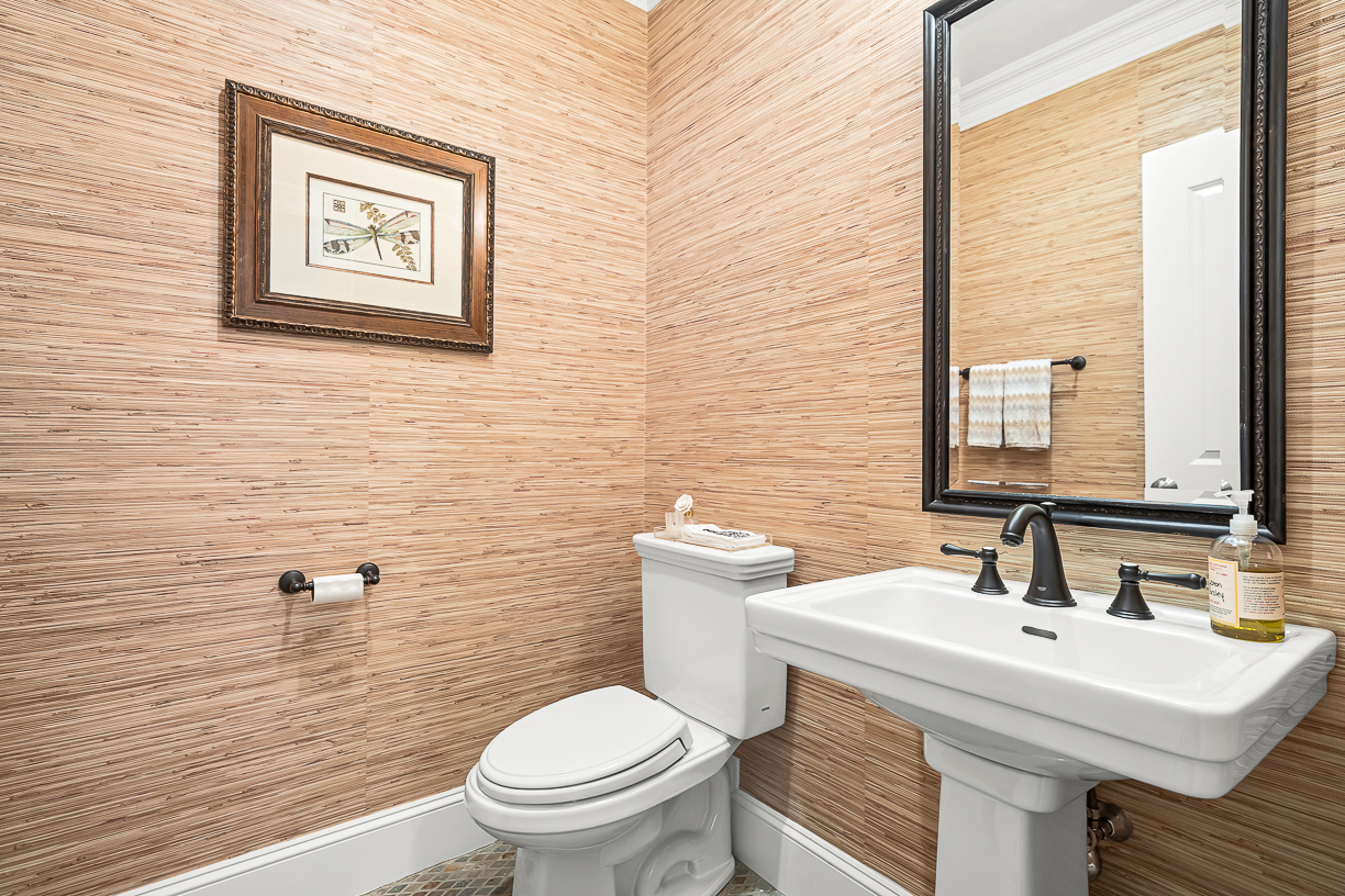 Country Way Needham, MA 02492 - Photo 14 of 27 a bathroom with a toilet a sink and a mirror