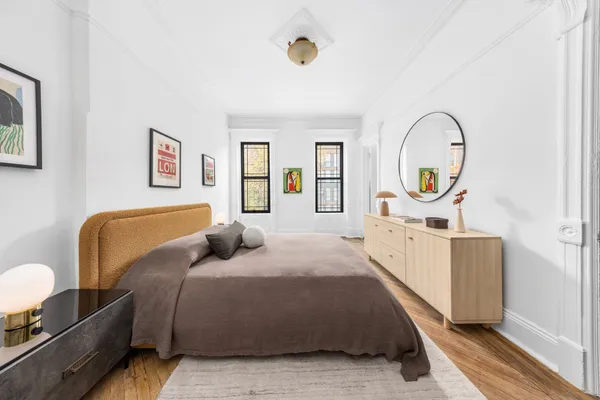 a bedroom with a bed and window