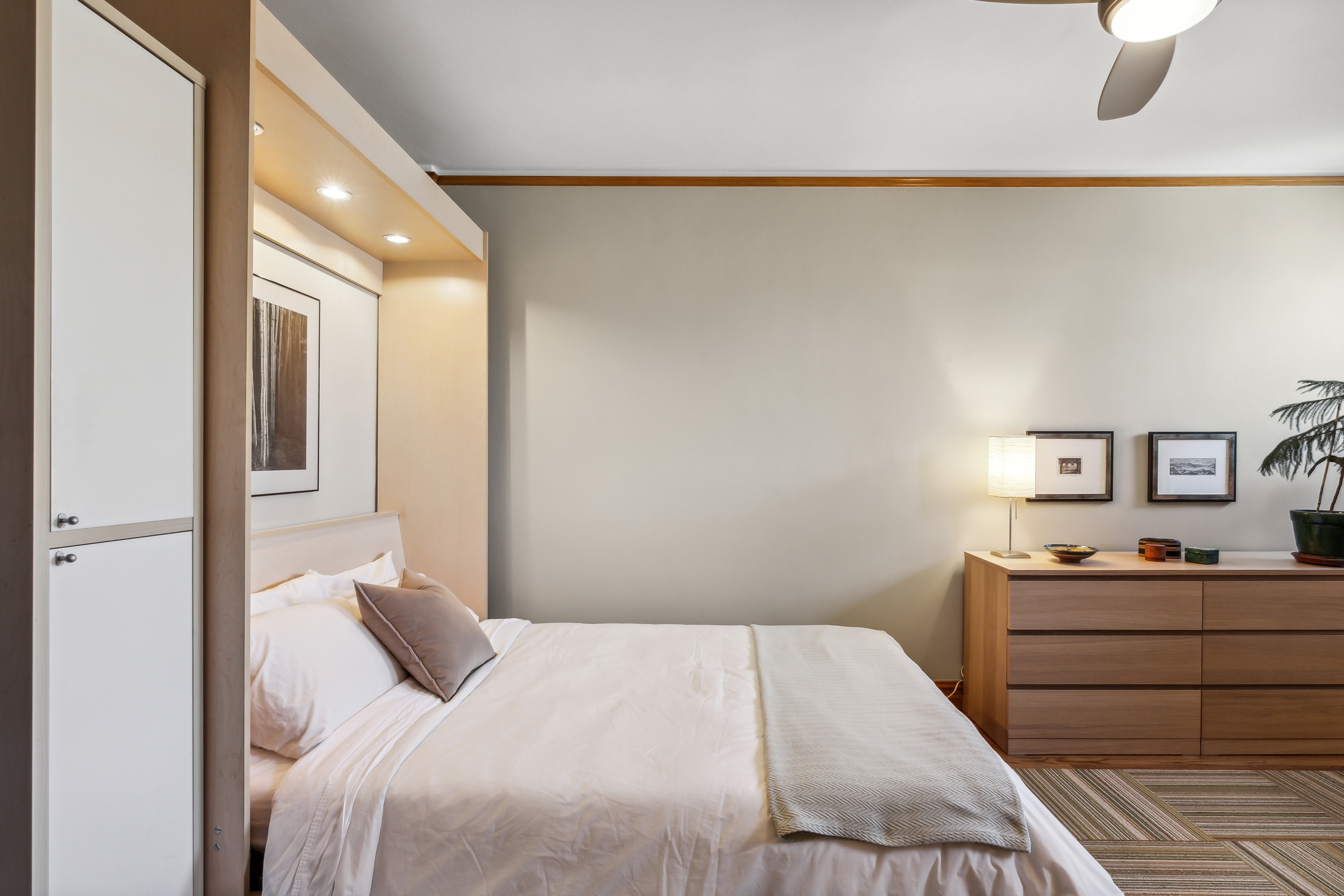 45 Park Terrace West, Unit 5A Manhattan, NY 10034 - Photo 7 of 22 a bedroom with a bed and a cabinets