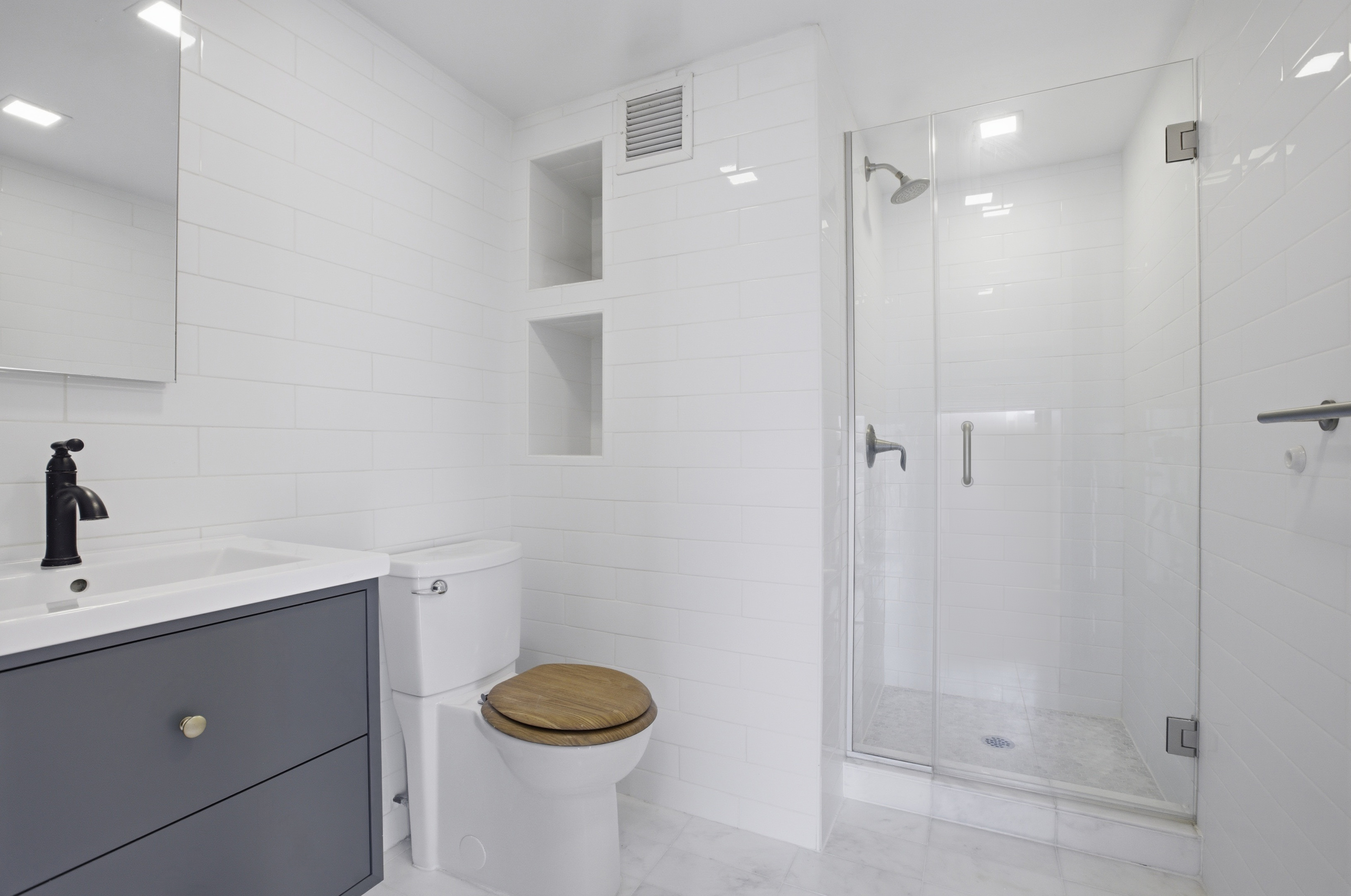 305 2nd Avenue, Unit 521 Manhattan, NY 10003 - Photo 12 of 20 a bathroom with a sink a toilet and shower