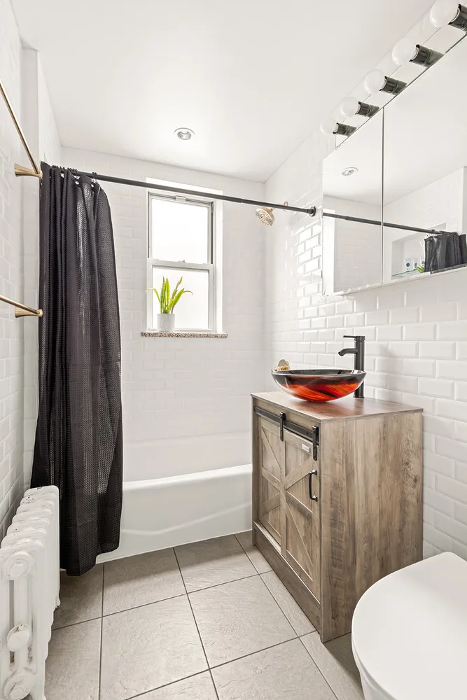 a bathroom with a sink a toilet and a bathtub