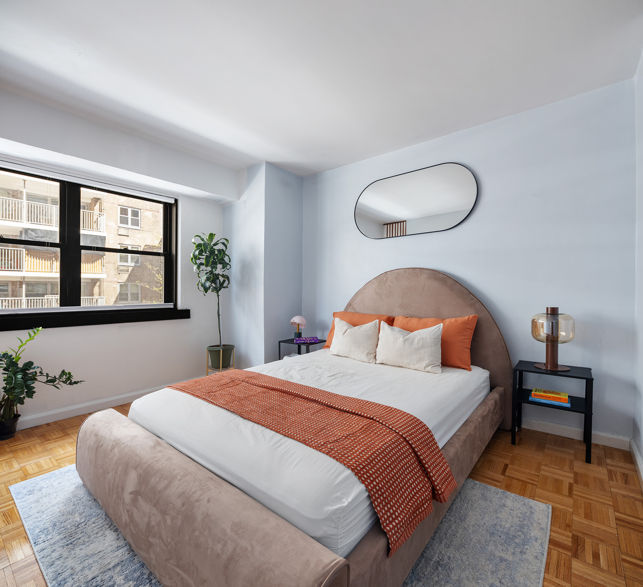 235 East 87th Street, Unit 5G Manhattan, NY 10128 - Photo 7 of 13 a bedroom with a large bed and windows