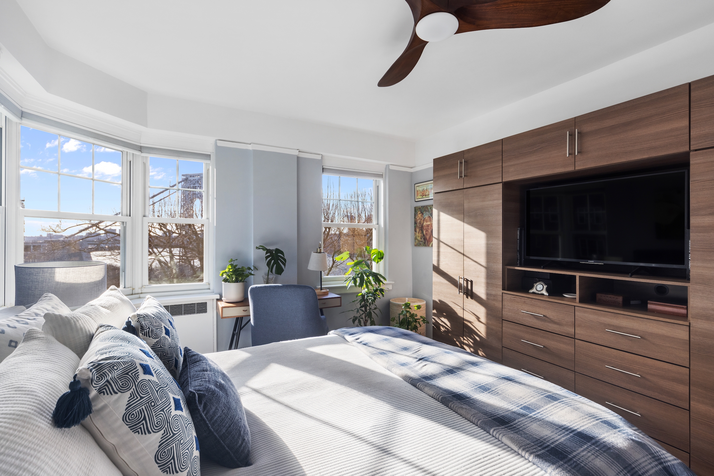 160 Cabrini Boulevard, Unit 22 Manhattan, NY 10033 - Photo 7 of 23 a living room with furniture and a flat screen tv