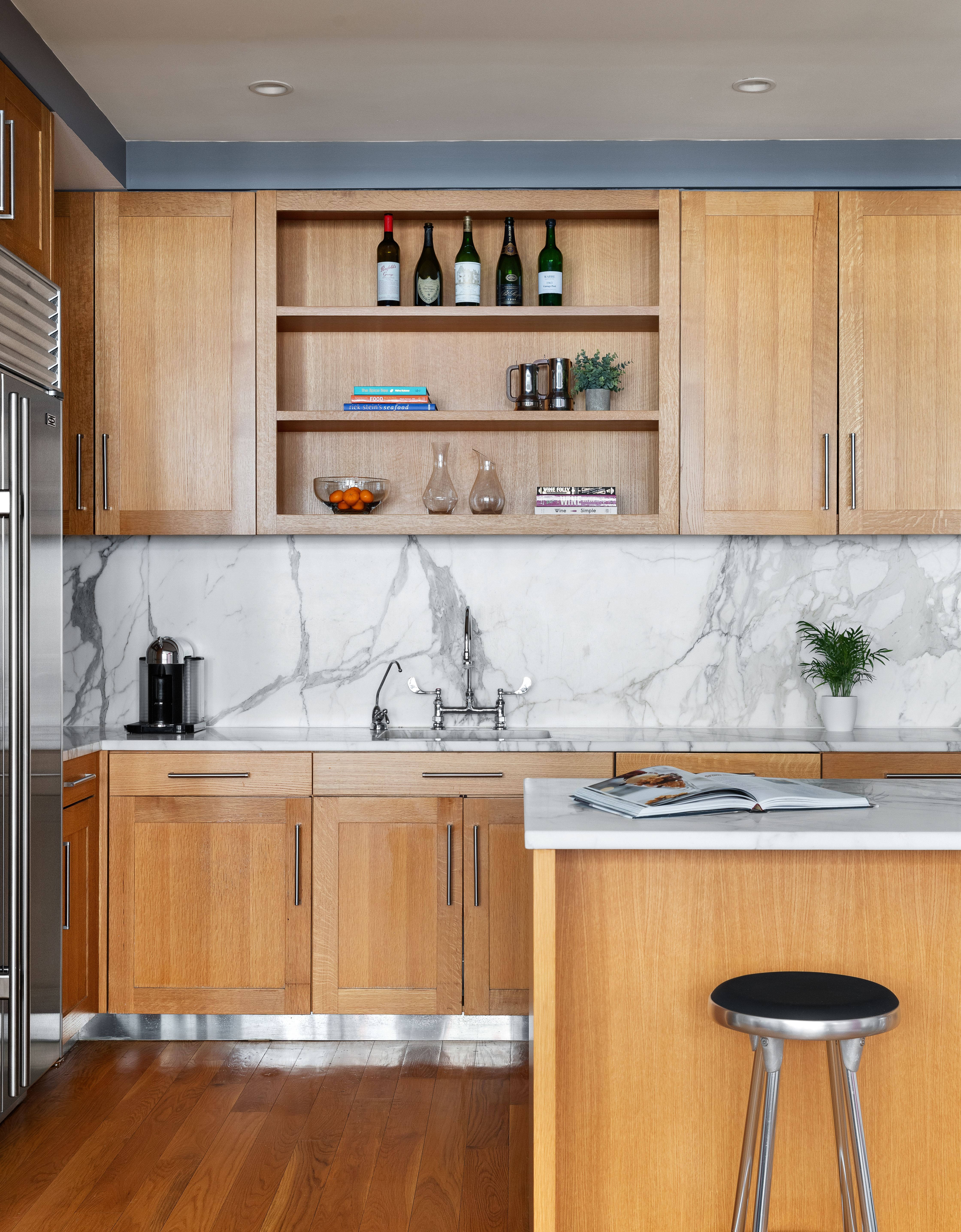 130 West 30th Street, Unit 3B Manhattan, NY 10001 - Photo 6 of 15 a view of a kitchen with wooden floor and cabinets