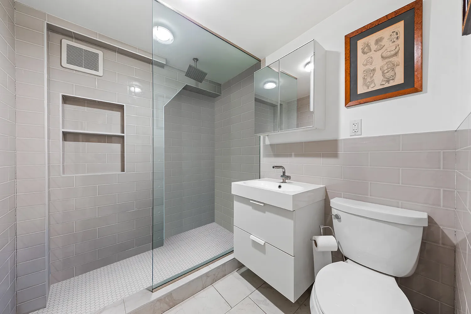 a bathroom with a toilet sink and shower