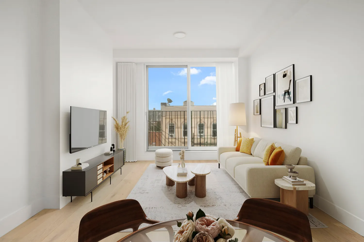 a living room with furniture and a flat screen tv