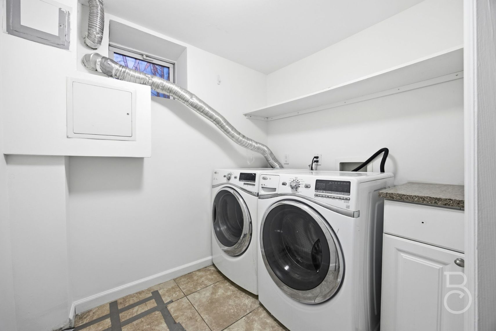 22-61 46th Street Queens, NY 11105 - Photo 14 of 24 a utility room with dryer and washer