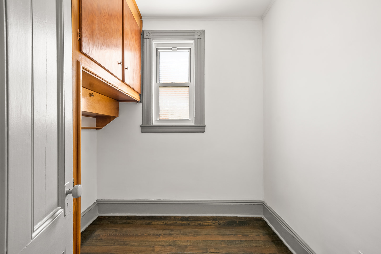 59-45 Palmetto Street Queens, NY 11385 - Photo 8 of 25 a view of an empty room with wooden floor and a window