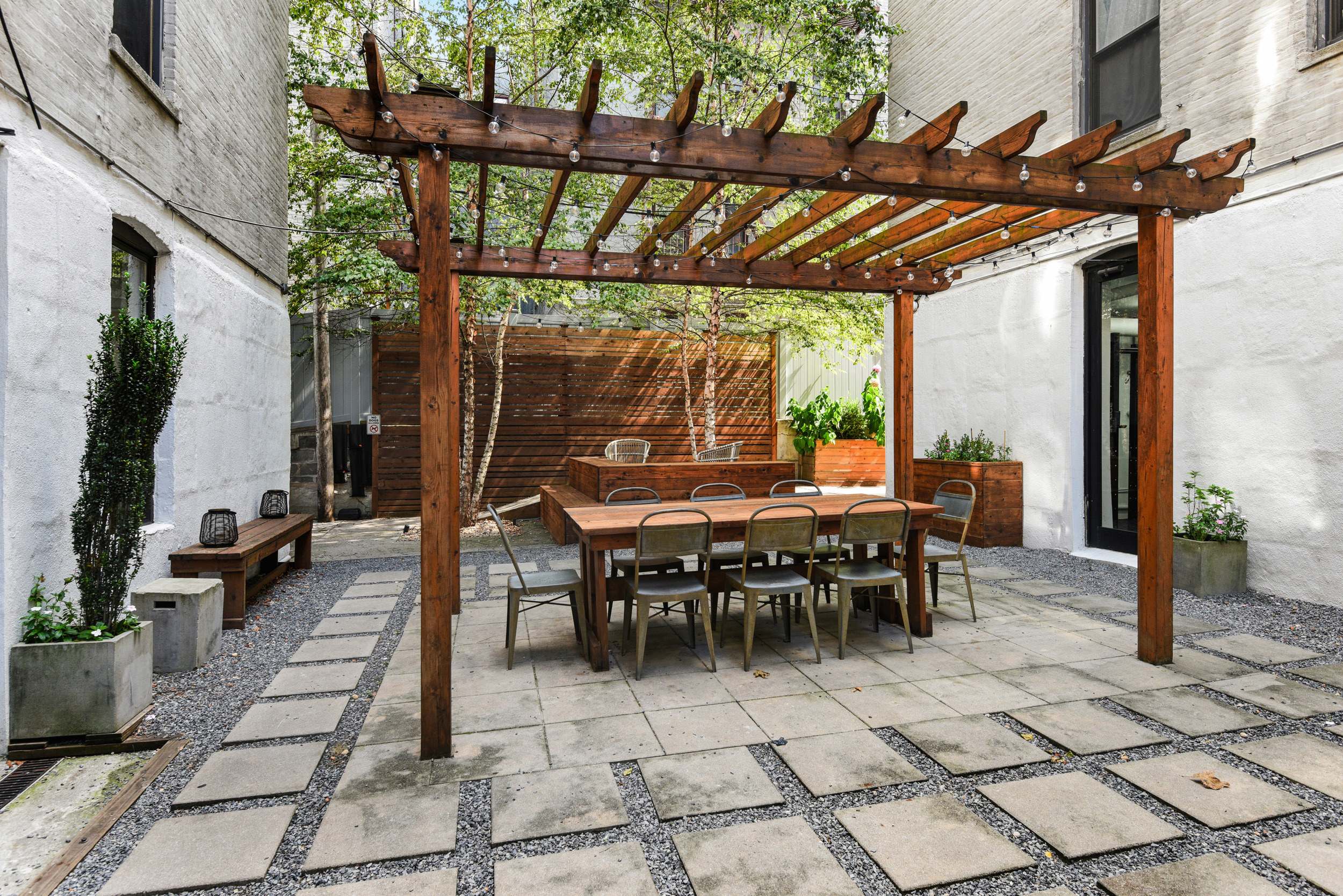 24-75 38th Street, Unit A1 Queens, NY 11103 - Photo 9 of 12 a view of a tables and chairs in patio