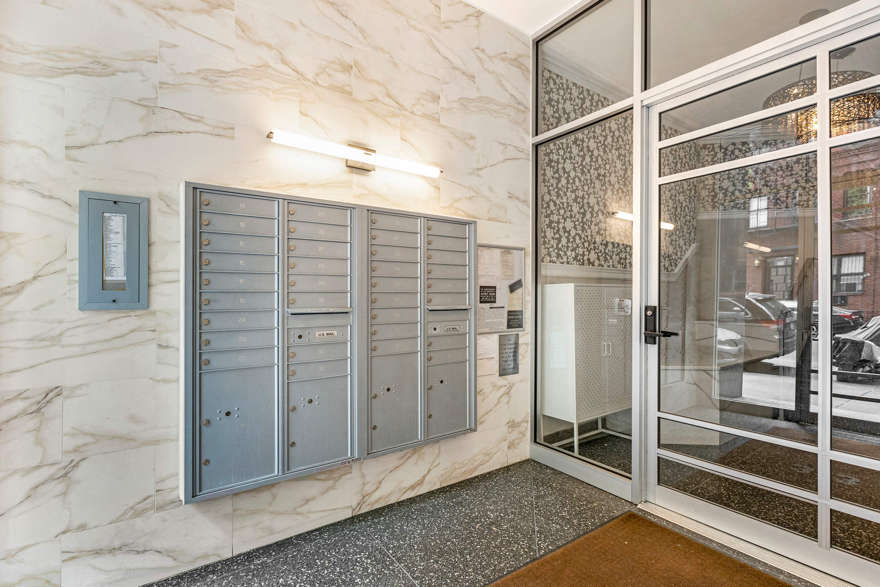 313 East 89th Street, Unit 4C Manhattan, NY 10128 - Photo 6 of 8 a view of a bathroom with a shower and a sink