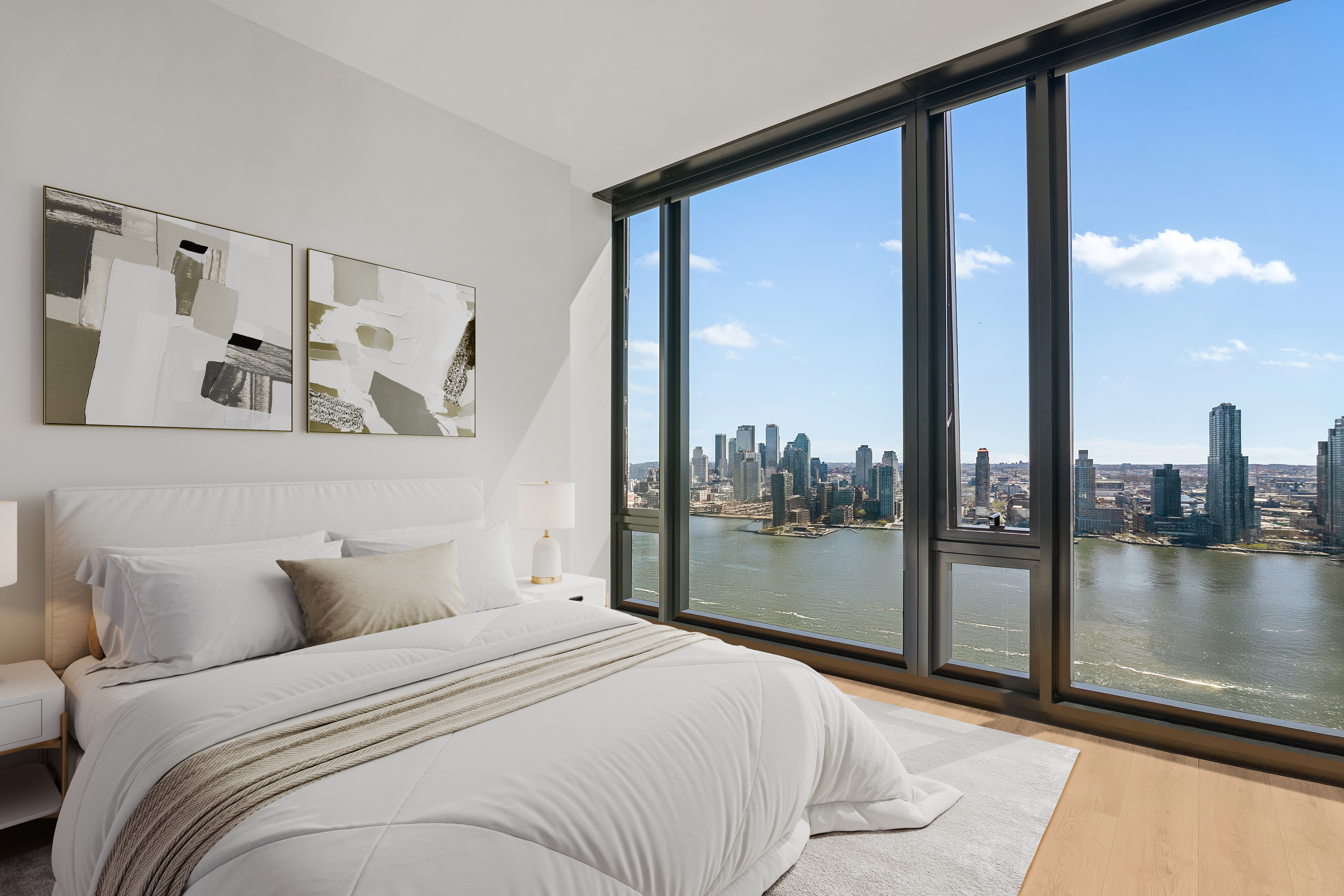 695 1st Avenue, Unit 33B Manhattan, NY 10016 - Photo 5 of 25 a bedroom with a large bed and a balcony view