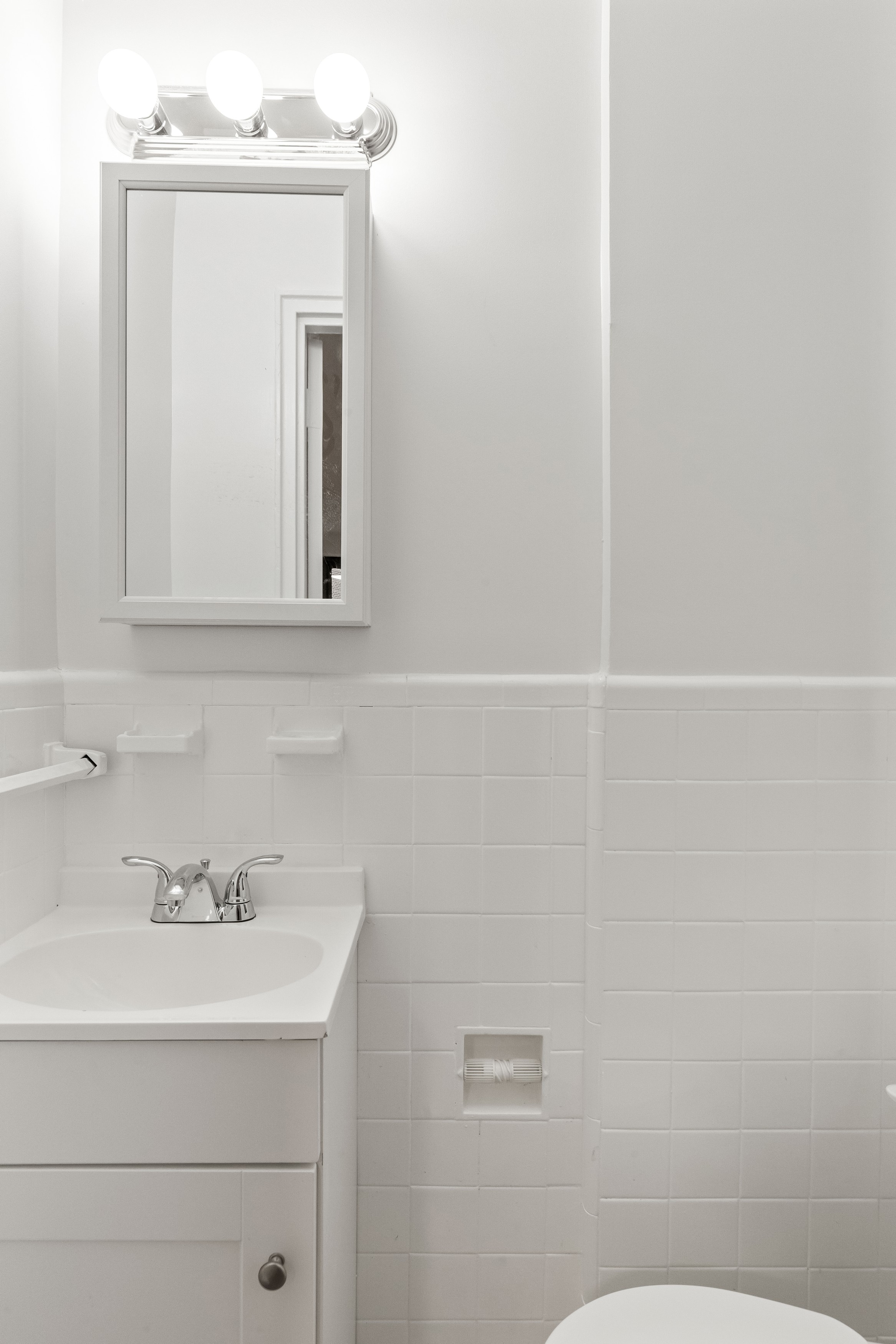 445 West 240th Street, Unit 3A Bronx, NY 10463 - Photo 6 of 8 a bathroom with a sink a toilet and mirror