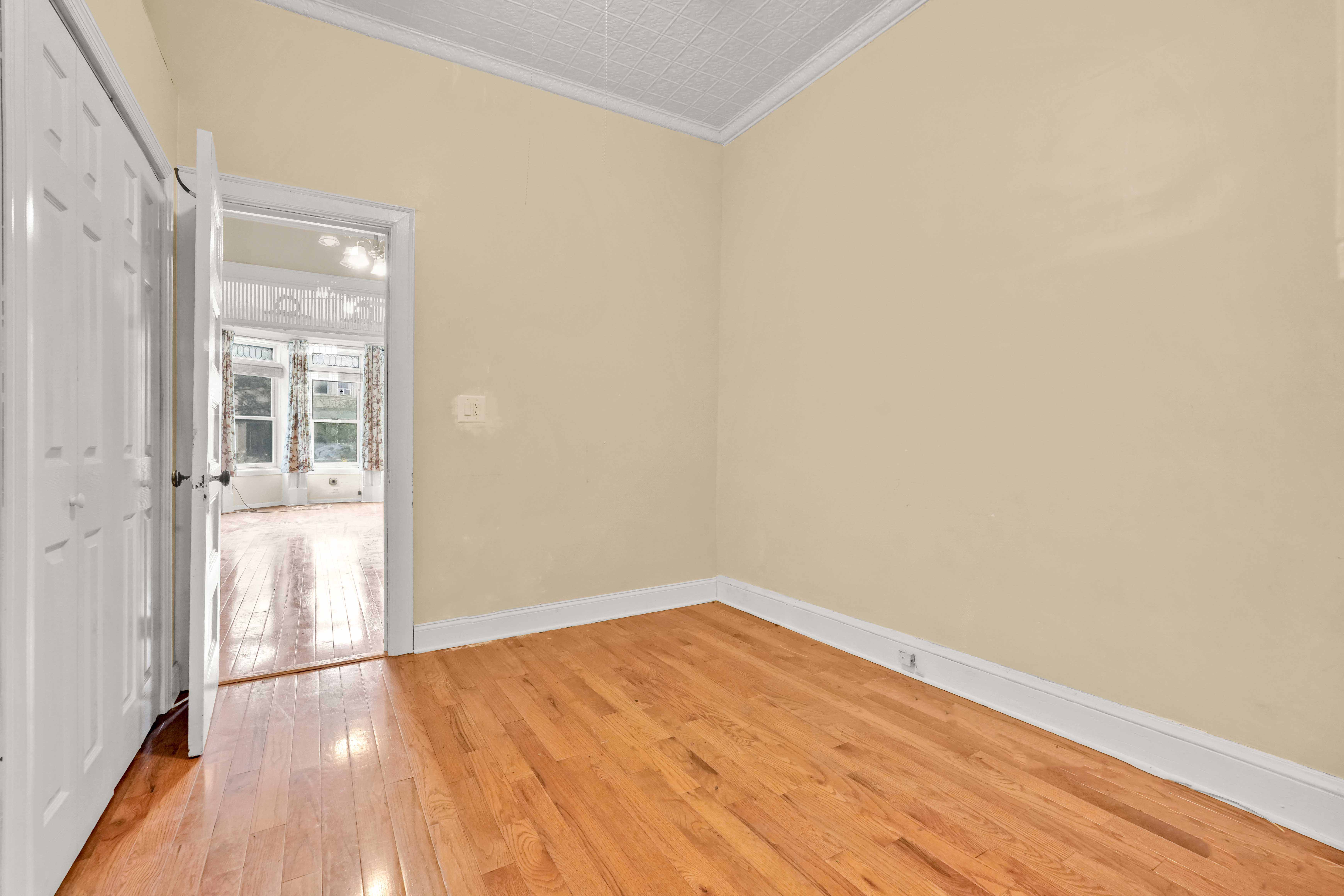 278 Lefferts Avenue Brooklyn, NY 11225 - Photo 41 of 56 a view of empty room with wooden floor
