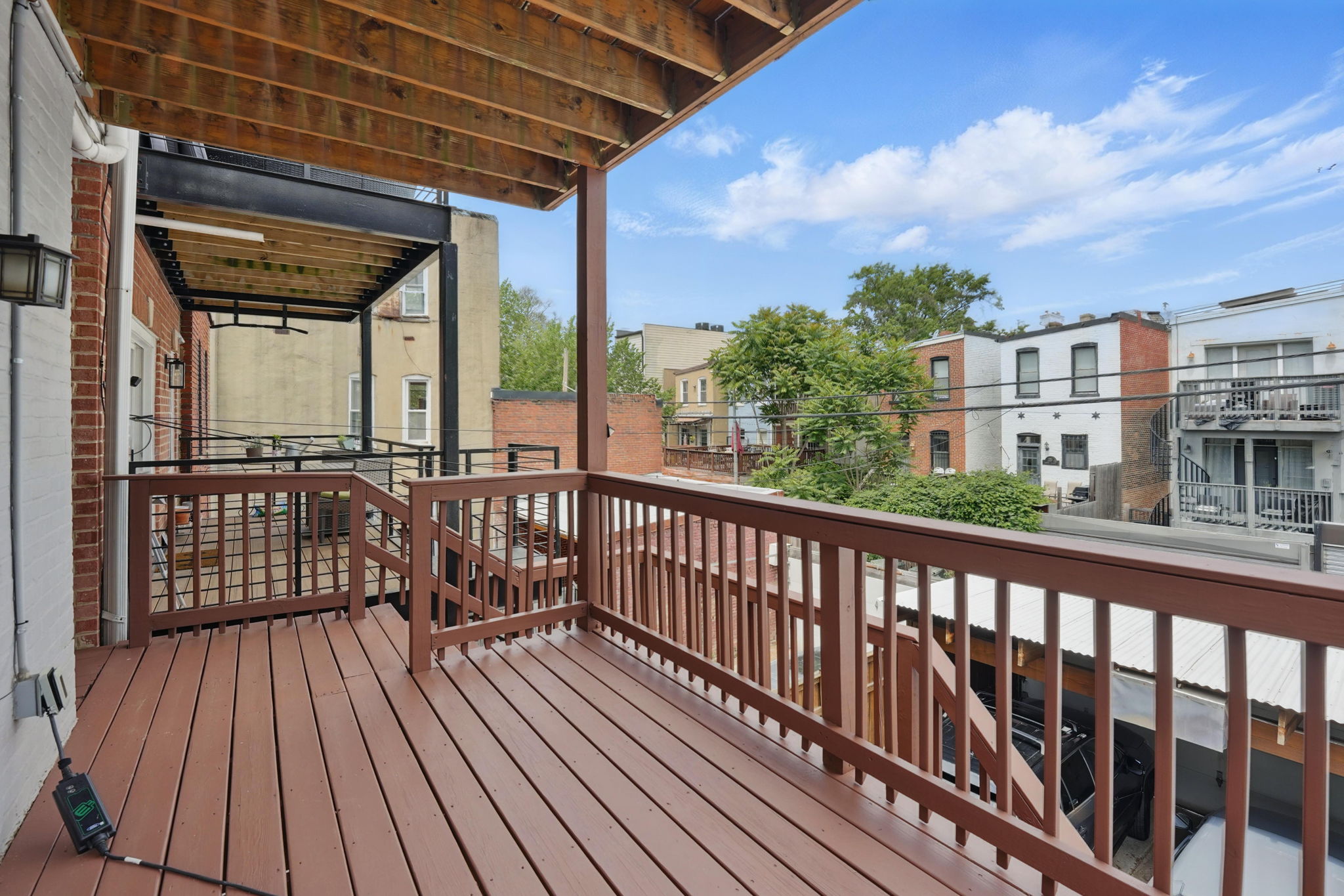 28 Q Street Northeast, Unit 2 Washington, DC 20002 - Photo 38 of 41 a view of a balcony with wooden floor