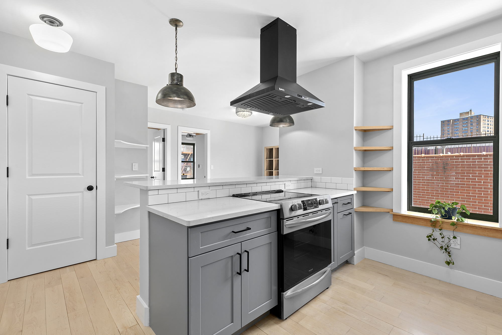 108 Division Avenue, Unit 22 Brooklyn, NY 11211 - Photo 2 of 11 a kitchen with stainless steel appliances granite countertop a stove and a sink