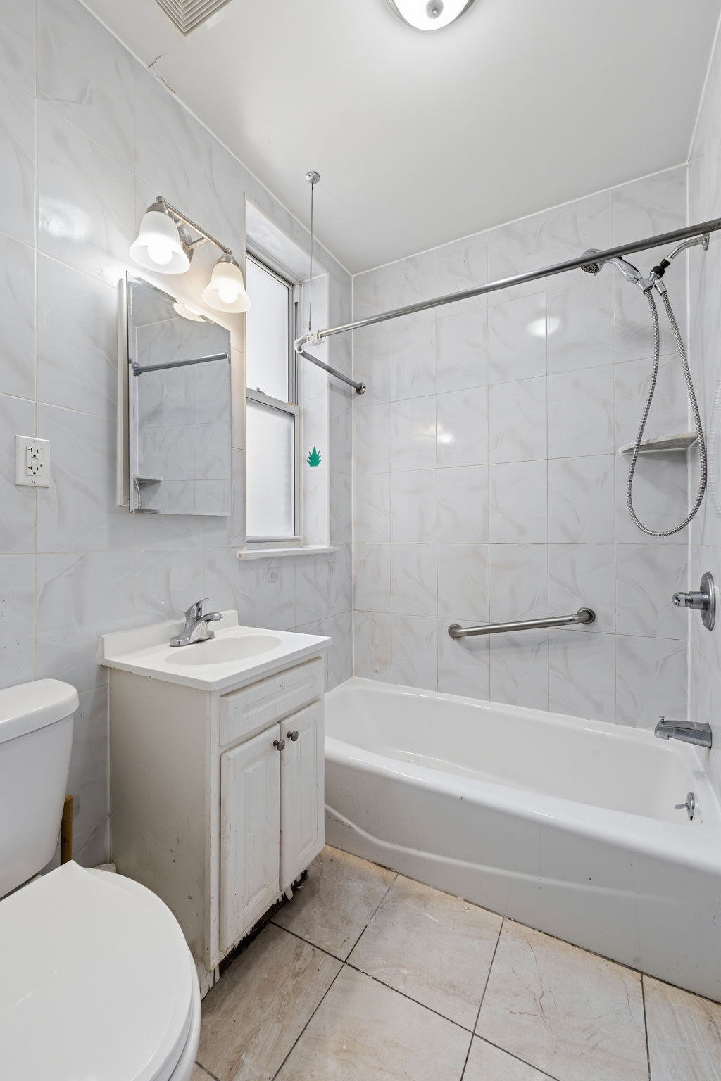 37 Chester Avenue Brooklyn, NY 11218 - Photo 8 of 14 a bathroom with a sink toilet and shower