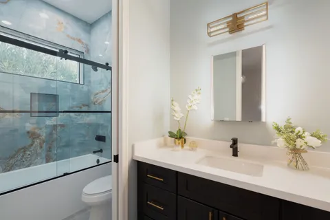 a view of a terrace with a floor to ceiling window and a couch