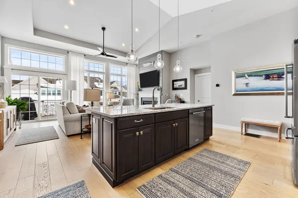 a spacious bathroom with a double vanity sink a large mirror and a bathtub