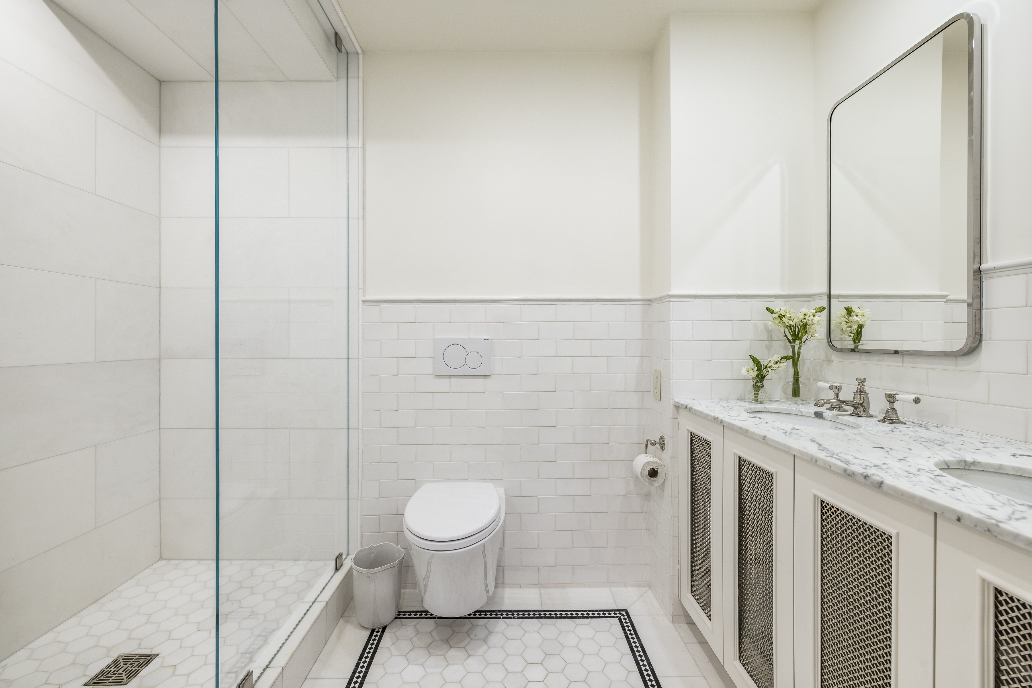 47 East 87th Street, Unit 7A Manhattan, NY 10128 - Photo 16 of 22 a bathroom with a granite countertop sink toilet and shower