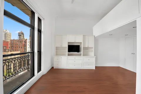 a view of a living room with a flat screen tv
