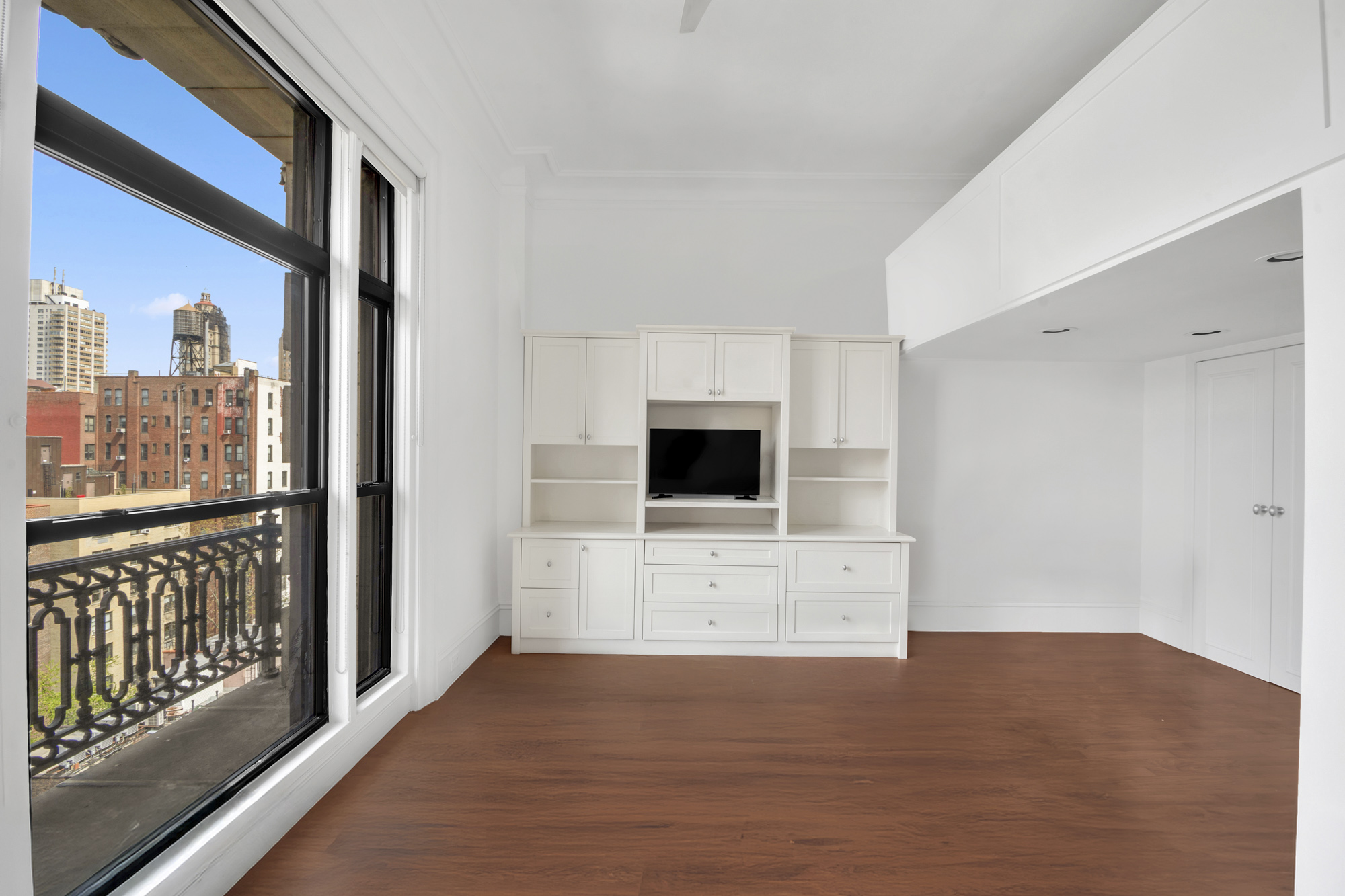 140 West 69th Street, Unit 107A Manhattan, NY 10023 - Photo 11 of 15 a view of a living room with a flat screen tv