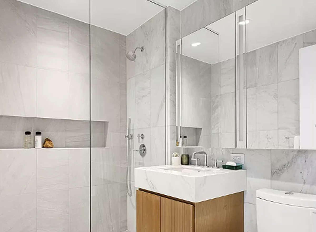 300 West 30th Street, Unit 4A Manhattan, NY 10001 - Photo 4 of 15 a bathroom with a sink vanity tub and a mirror