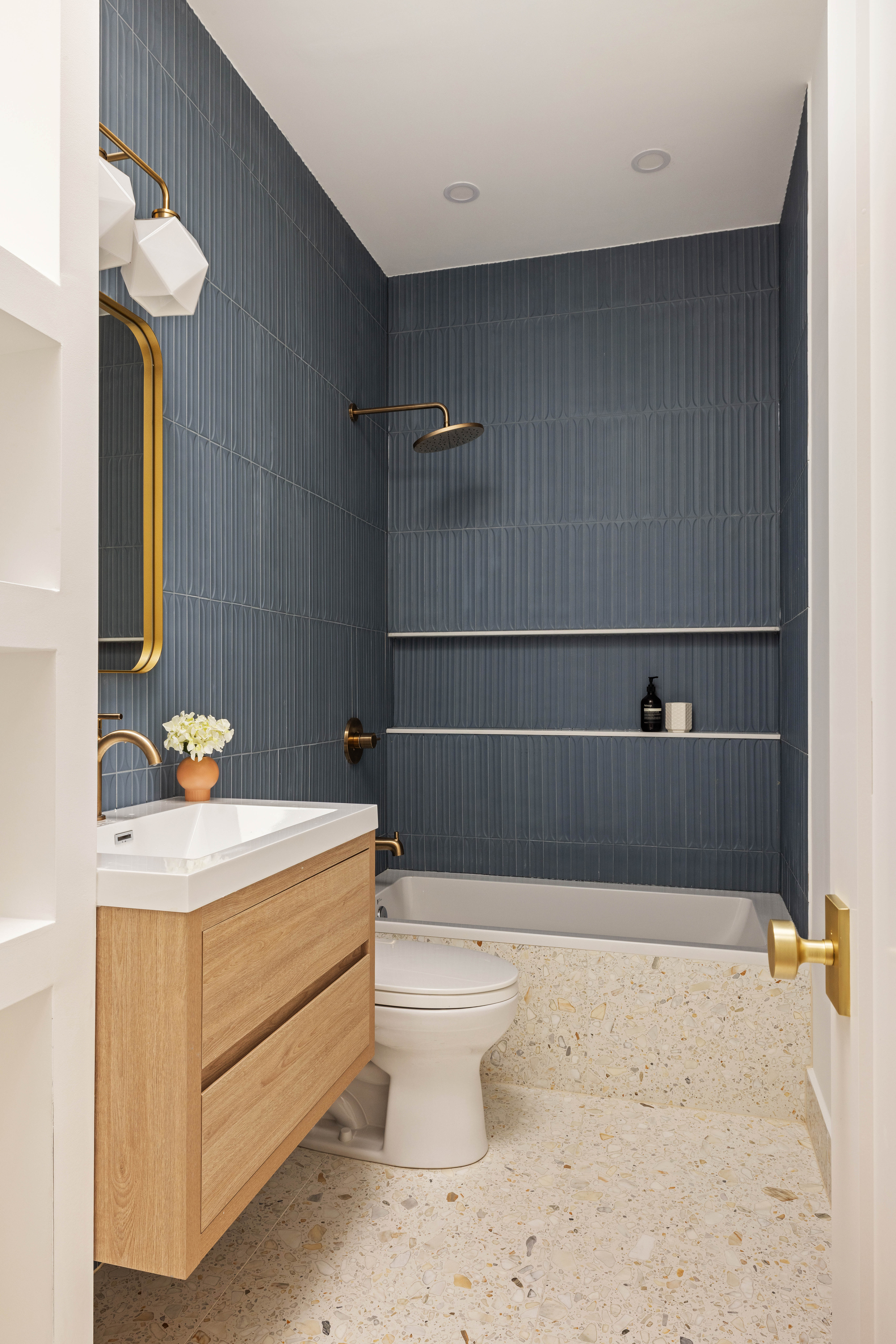 131 Weirfield Street Brooklyn, NY 11221 - Photo 10 of 14 a bathroom with a sink a toilet and a mirror