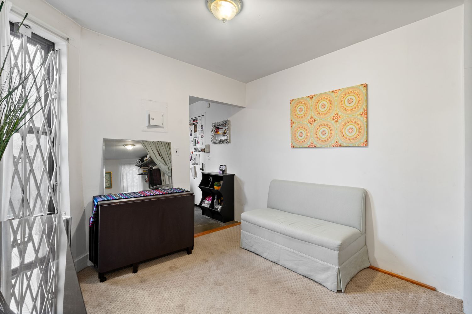 a living room with furniture and a window