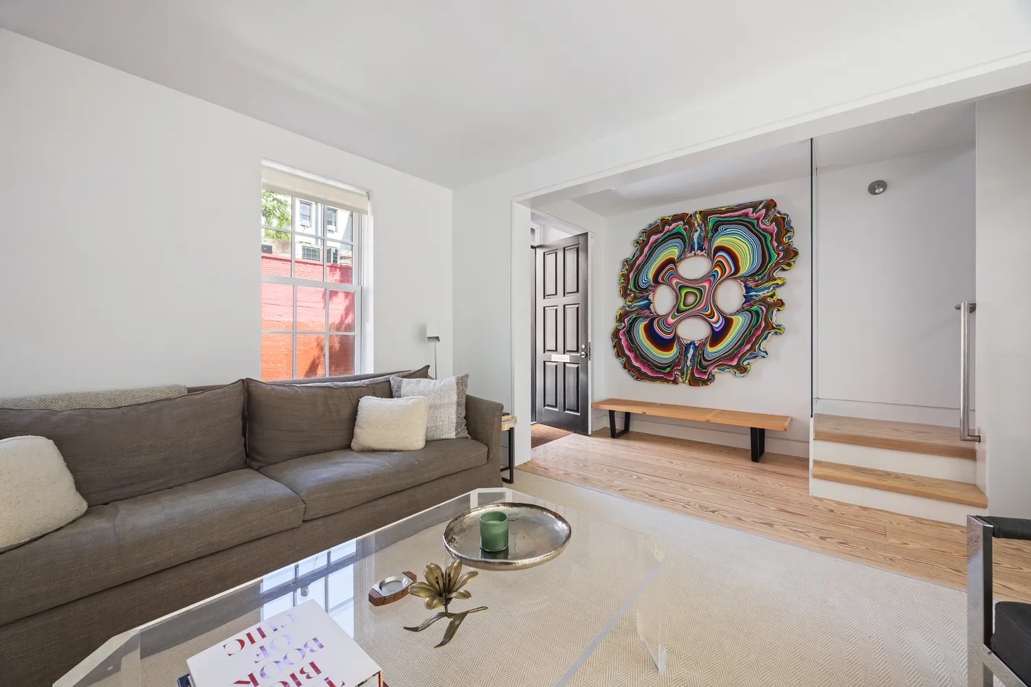 a living room with furniture and a window