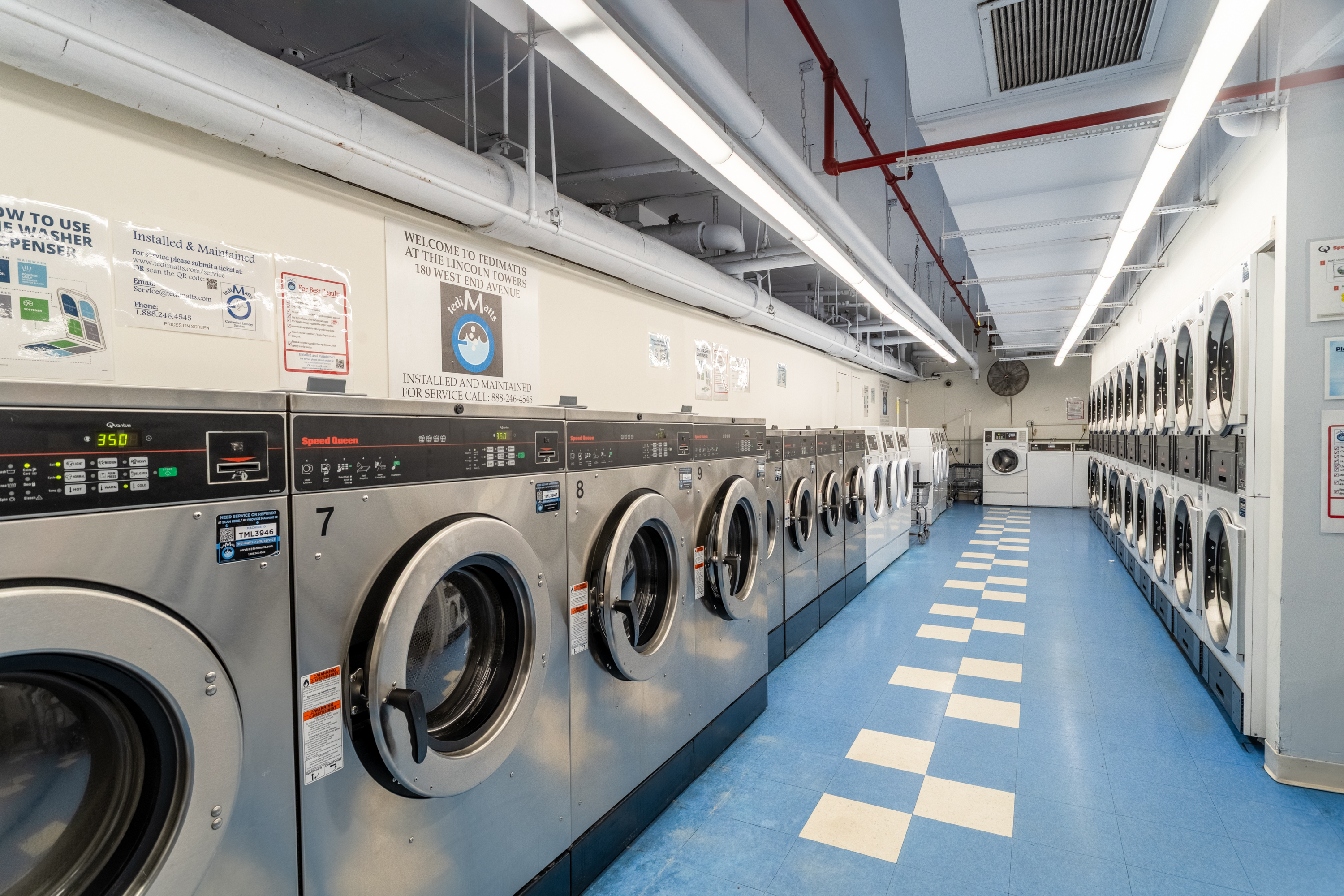 180 West End Avenue, Unit 23D Manhattan, NY 10023 - Photo 20 of 22 a view of a hallway with washer and dryer